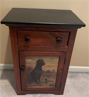 Night stand with picture of dog and duck on