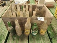 Vintage wood box and pop bottles.