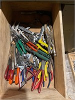 Drawer, full of pliers, snips, vice grips, etc.