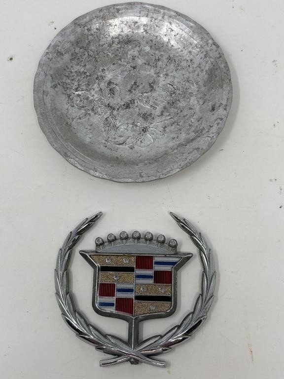 Cadillac hood emblem, and Quaker State motor