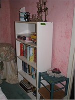 Bookshelf with misc books, decor
