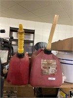 two plastic gas cans
