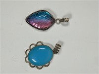 2 blue stones and sterling silver casing