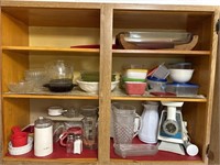 Cupboard full of miscellaneous dishes food