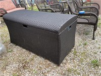 Outdoor wicker chest with cushions