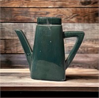 Green pottery pitcher with lid