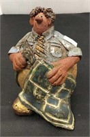 Unique pottery figure of man with hand tool