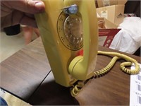 Vintage Yellow rotary telephone.