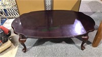 Dark finish coffee table in the Queenanne style,