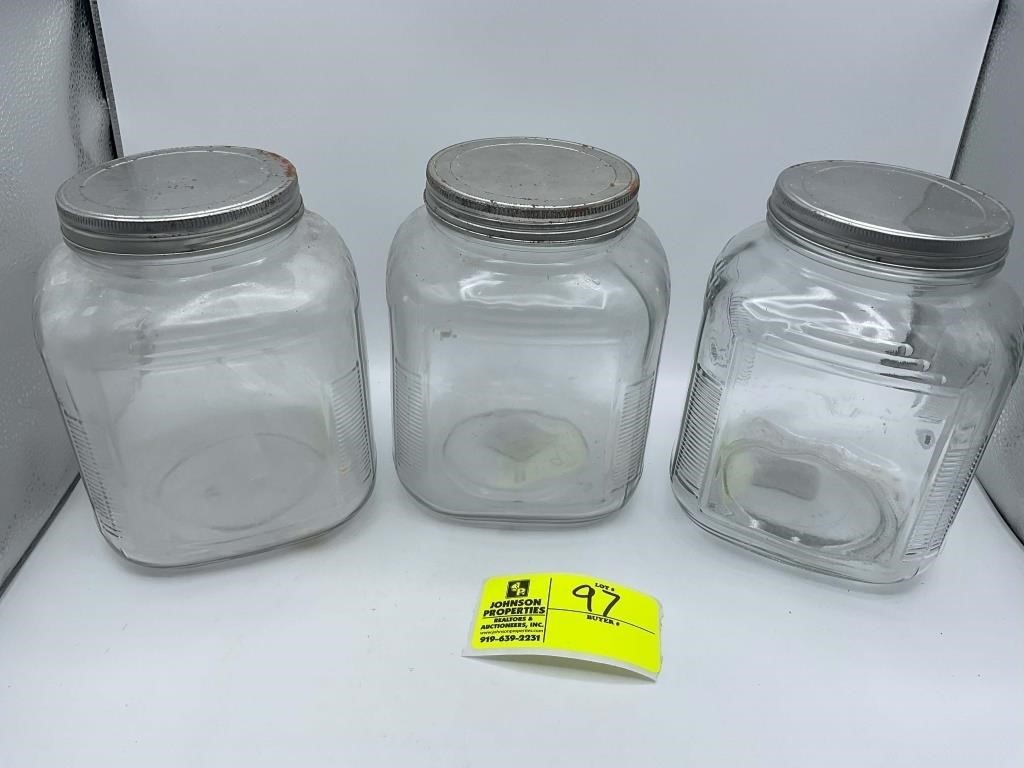GROUP OF THREE LARGE GLASS JARS WITH LID