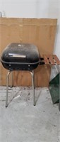 MECO charcoal grill with fold down side Shelf