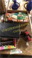 Briefcase, colored paper, box of electronic parts