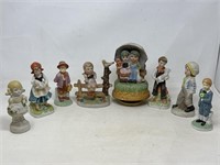 Assortment of figurines, one is musical