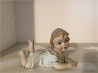 PORCELAIN PIANO BABY - MARKED ON THE BACK