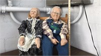 Porcelain grandma/grandpa dolls on wooden bench