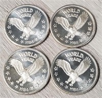 (4) World Trade 1oz Silver Rounds