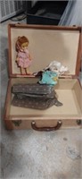 Travel case and doll with extra outfits