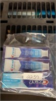 Three tubes of crest toothpaste