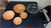 Large Pyrex glass bowl and set of wood bowls