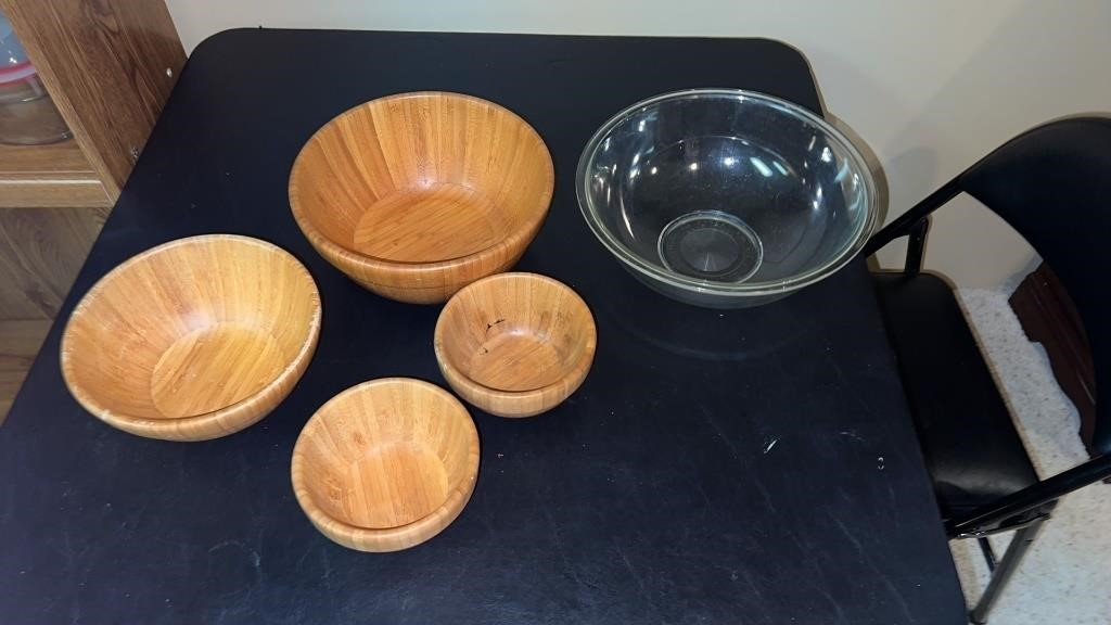 Large Pyrex glass bowl and set of wood bowls