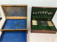 2 cutlery box.  1 empty. 1 with cutlery