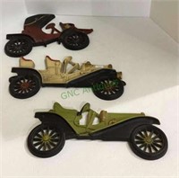 Vintage metal wall plaques of antique cars by