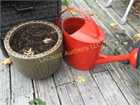ceramic planter and metal watering can