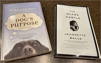 E1) Lot of 2 books, a dog’s purpose and the glass