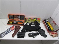 Assorted gun cleaning kits and holsters- Outers