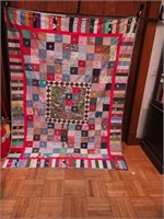 Hand- and machine-stitched quilt, marked made by