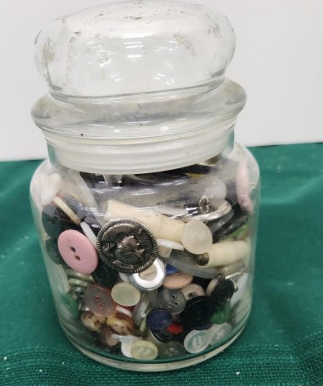 Jar of buttons and sewing