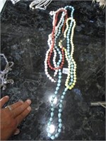 beaded necklaces .