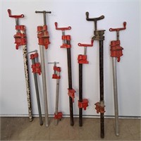 8 Pipe clamps. Tallest is 3ft