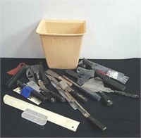 Group of painting tools, small garbage can and