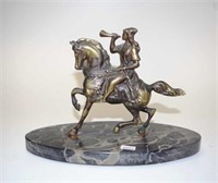 Bronzed figure of a man on horseback
