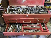 Red tool box with miscellaneous tools