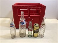 Assorted pop bottles in pop case