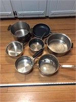 7- assorted stainless pot, pans, all pictured