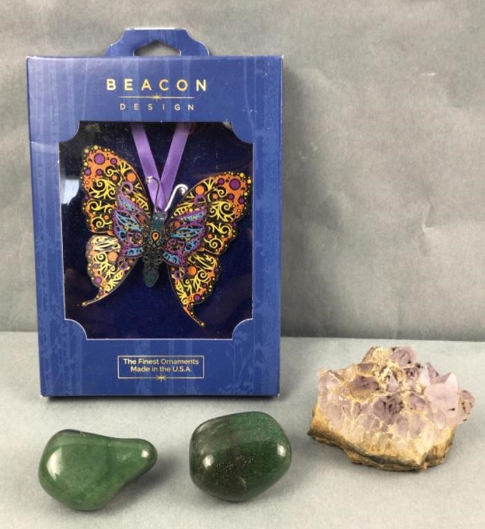 Butterfly ornament, polished rocks, and stone