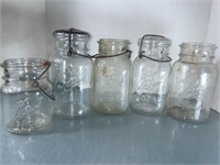 5 Ball clear glass Mason jars. Some with