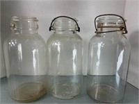 3 Clear glass half gallon Mason jars. 2
