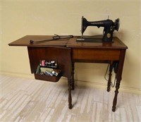 Singer Electric Sewing Machine in Cabinet.