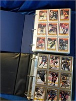 2 full binders of hockey cards.