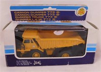 New Caterpillar diecast dump truck in box,