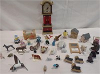 Wooden clock, miniature animals, wooden houses,