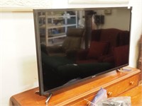 Samsung 31" flat screen TV with two remotes
