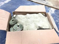 Nearly full box of coil roofing nails