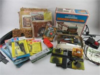 Box of assorted model train supplies