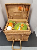 Vintage picnic basket with dishware