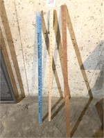 Three advertising yard sticks